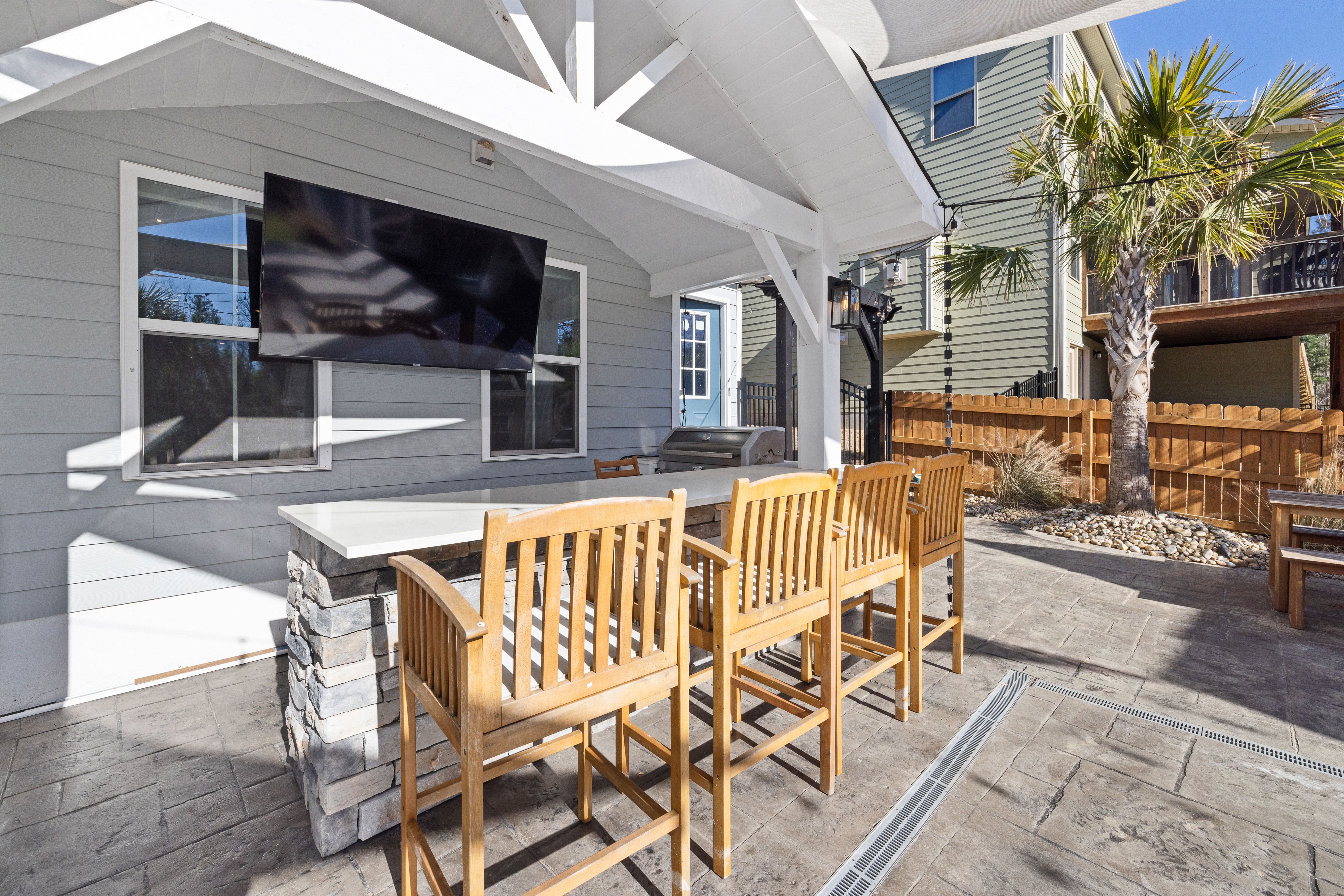 Custom outdoor kitchen and gathering space in the evening